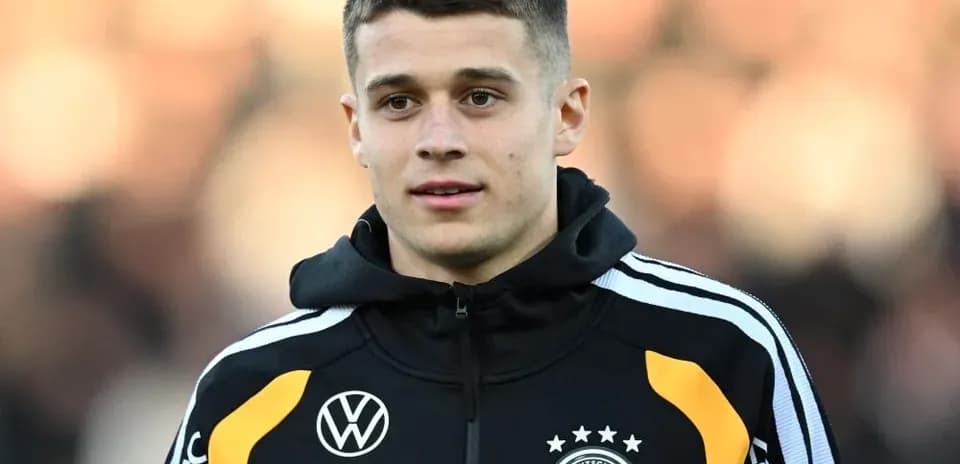 Player wearing Germany team jacket during warm-up