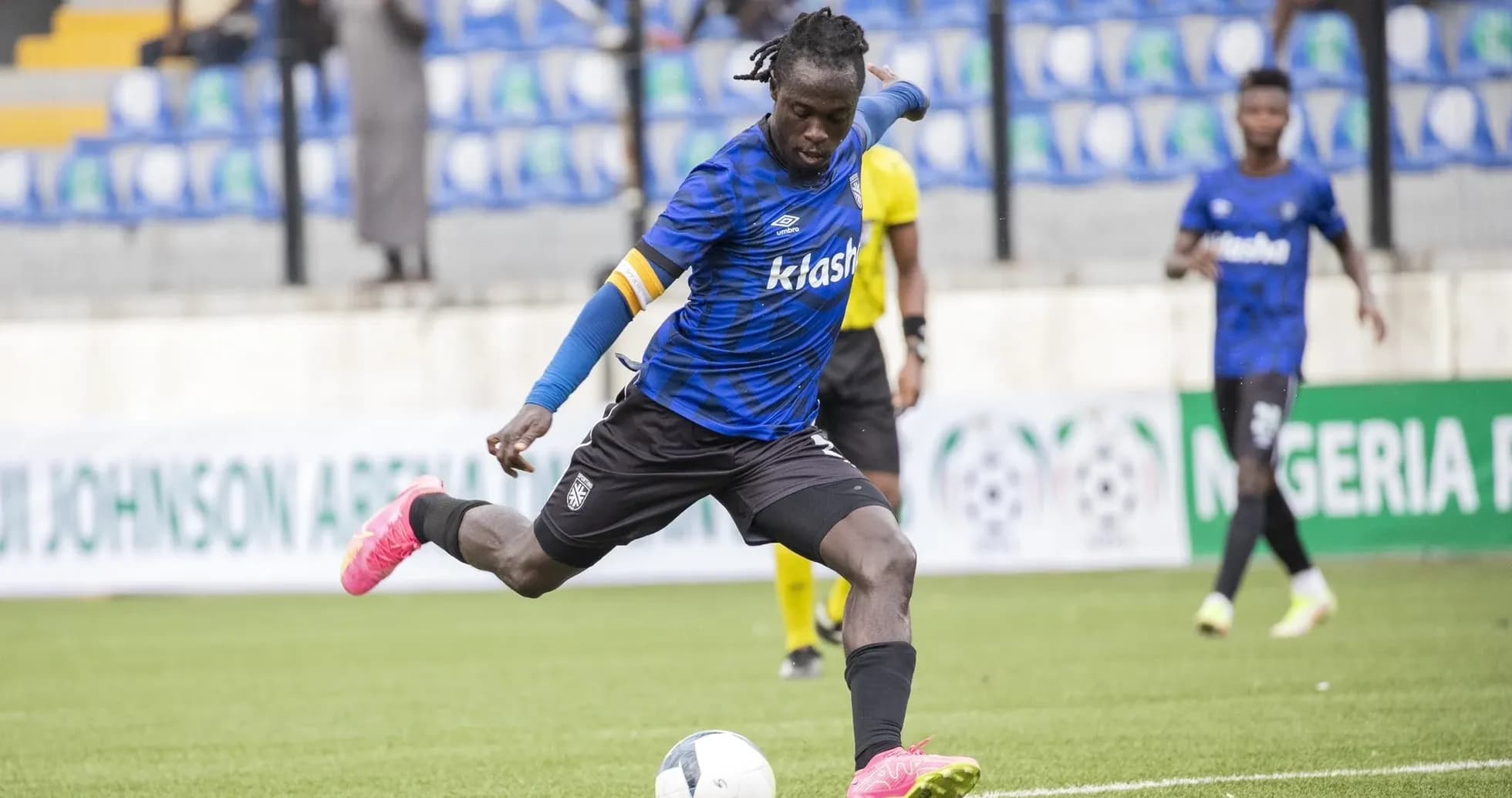 Player kicking ball during Kano Pillars match