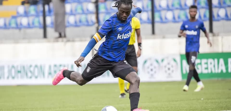 Player kicking ball during Kano Pillars match
