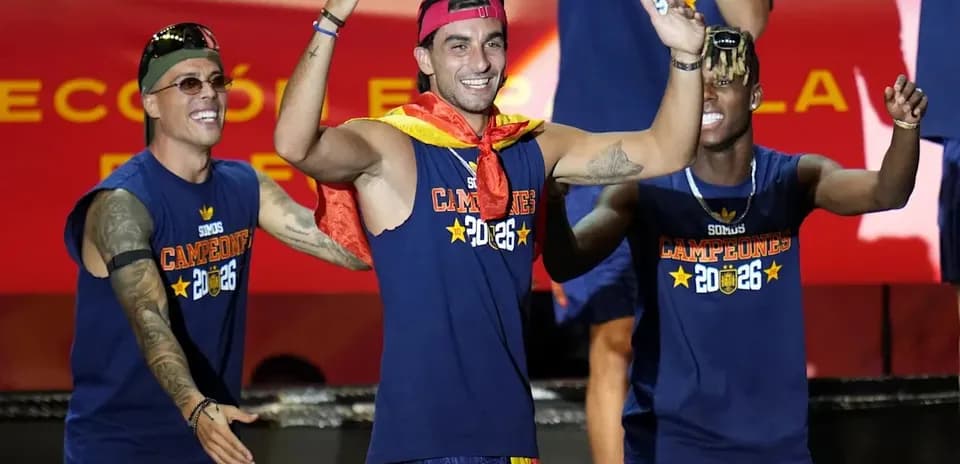 Players celebrating on stage with medals and banners