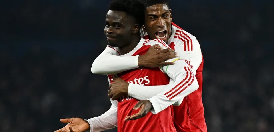 Arsenal players celebrating a goal together