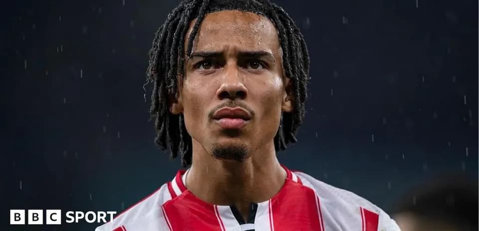 Brentford player in rain during match close-up