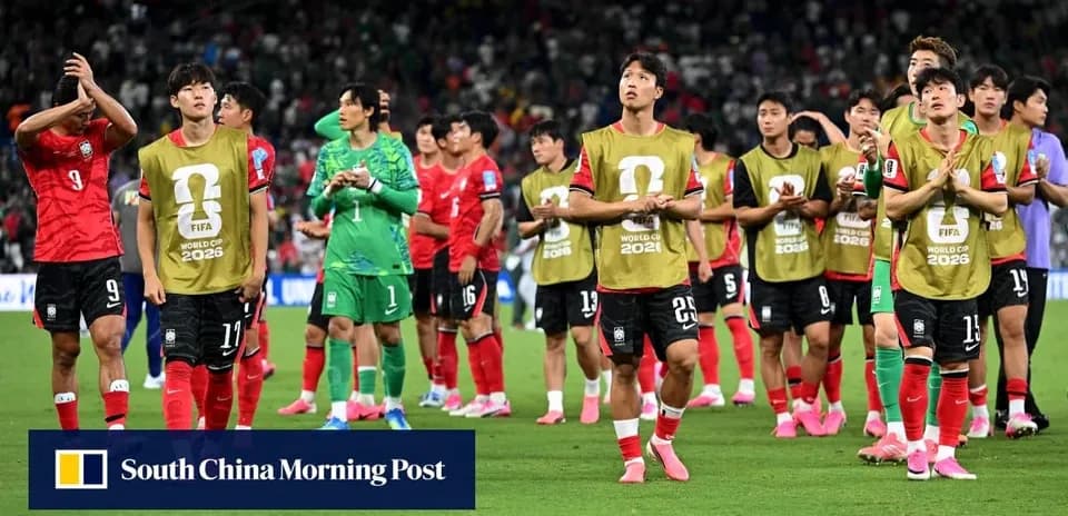 South Korea team applauding fans after match