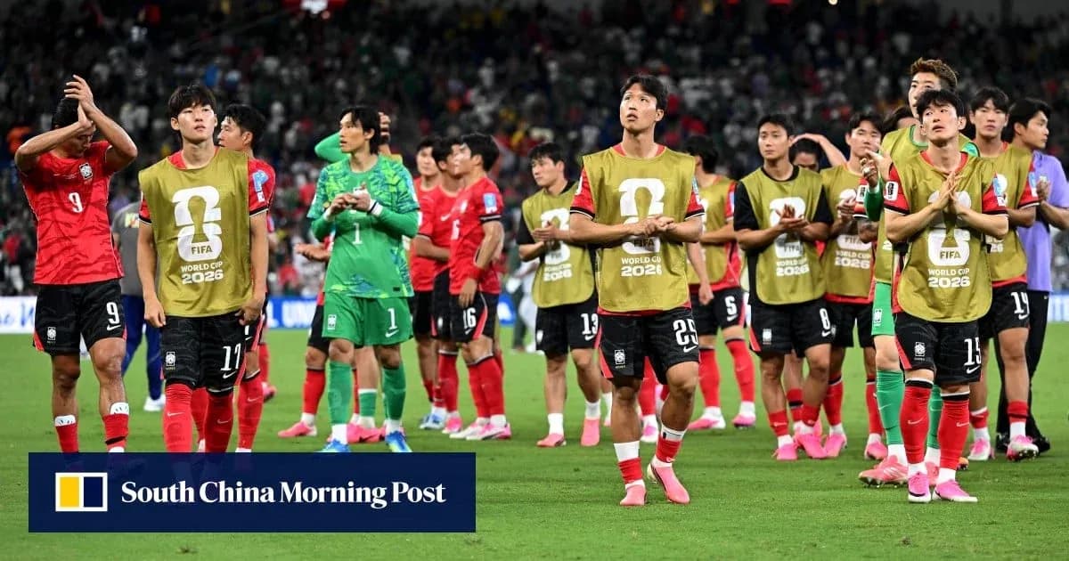 South Korea team applauding fans after match