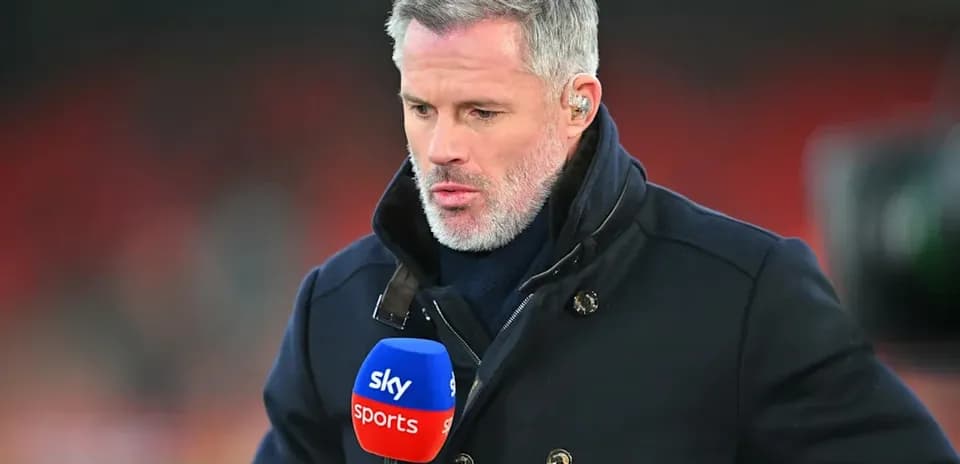 Sports analyst holding microphone during broadcast segment