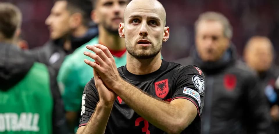 Player applauding after a match in Albania jersey
