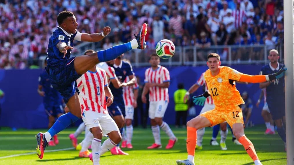 Player kicking ball during intense soccer match