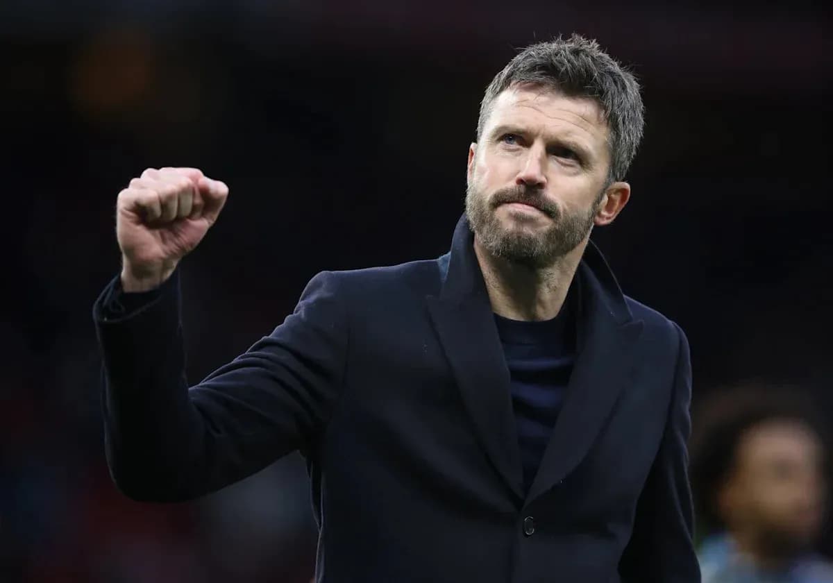 Coach celebrating with a fist pump after match
