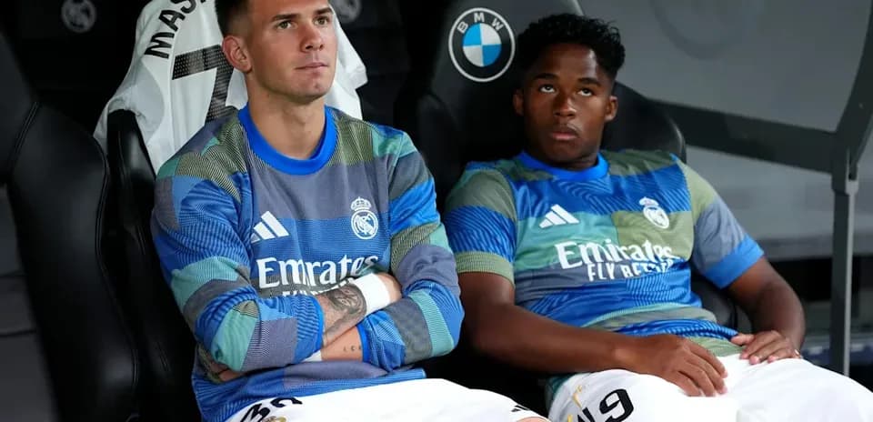 Two Real Madrid players seated on the bench