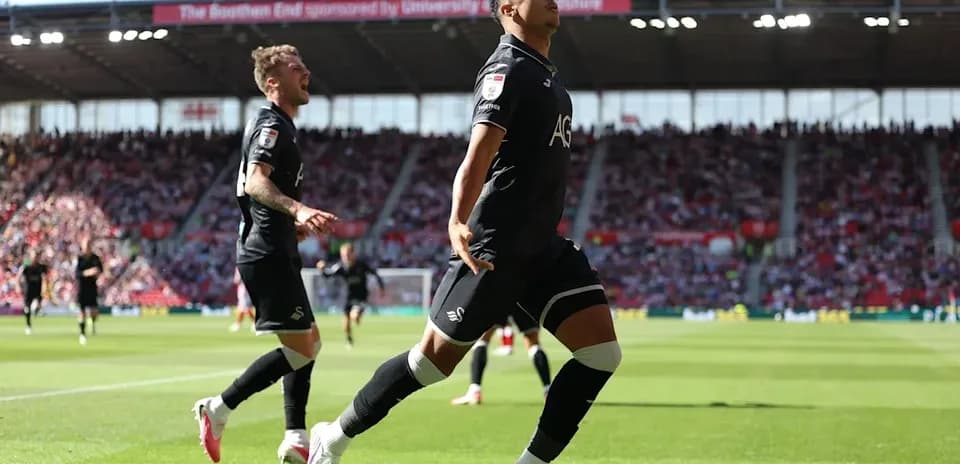 Swansea City player celebrating a goal during match