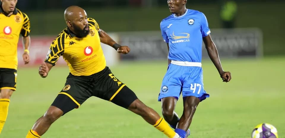 Two players competing for the ball on the field