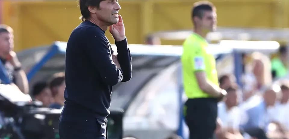 Coach observing the match from the sidelines