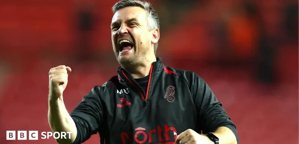 Coach celebrating passionately after a match victory