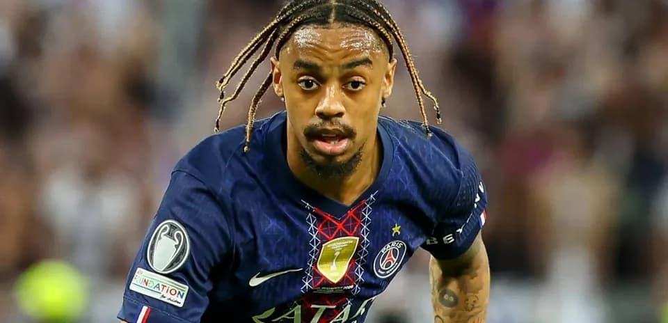 Player in PSG kit running during a match