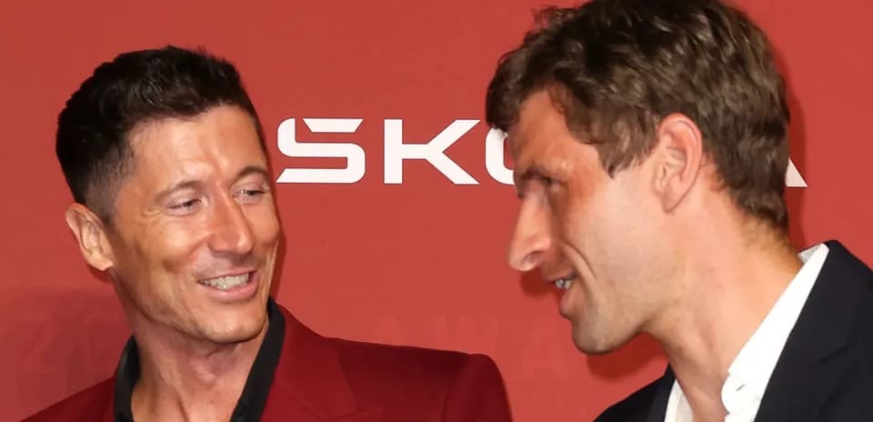 Two football players talking at an awards event