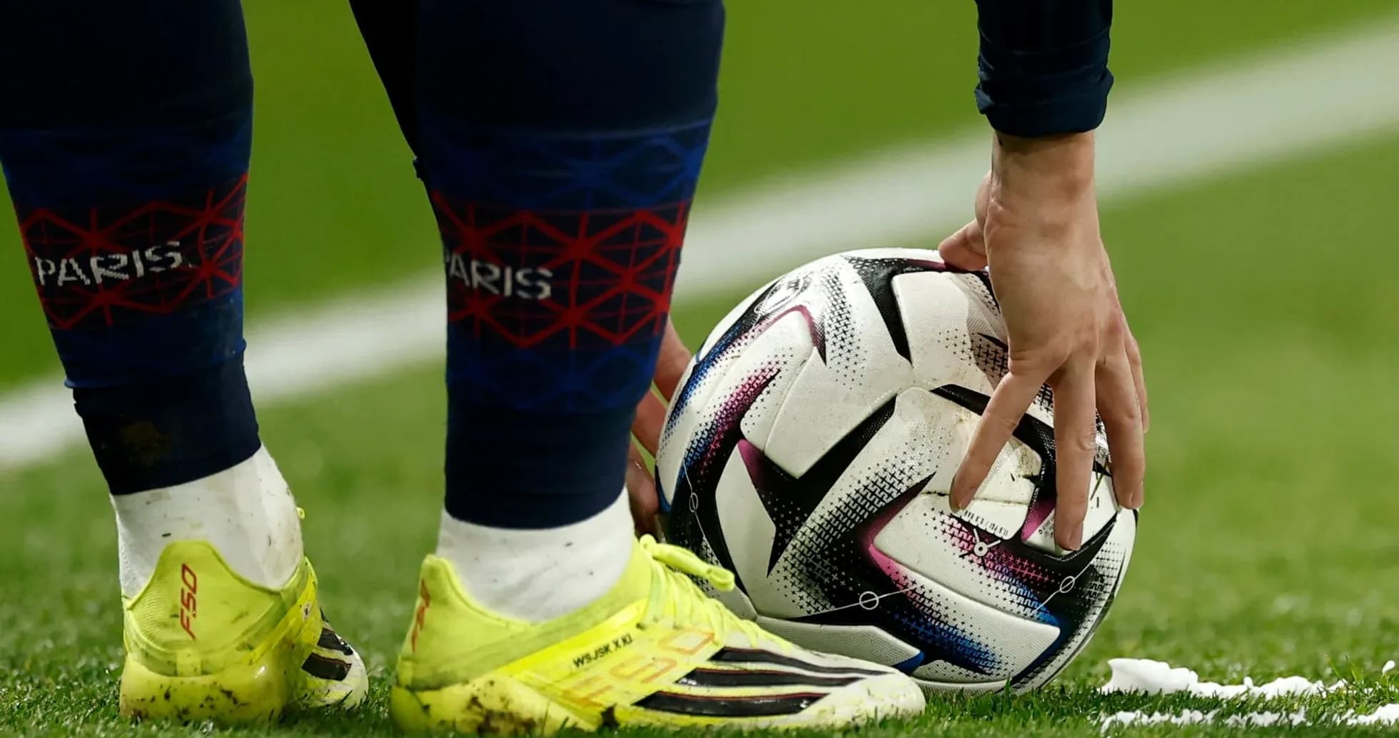 Player preparing to take a free kick with ball