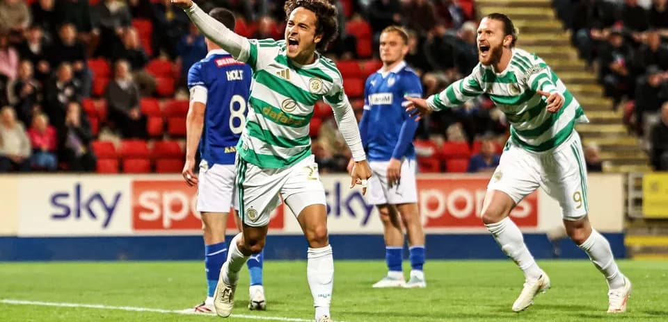 Celtic players celebrating a goal during match
