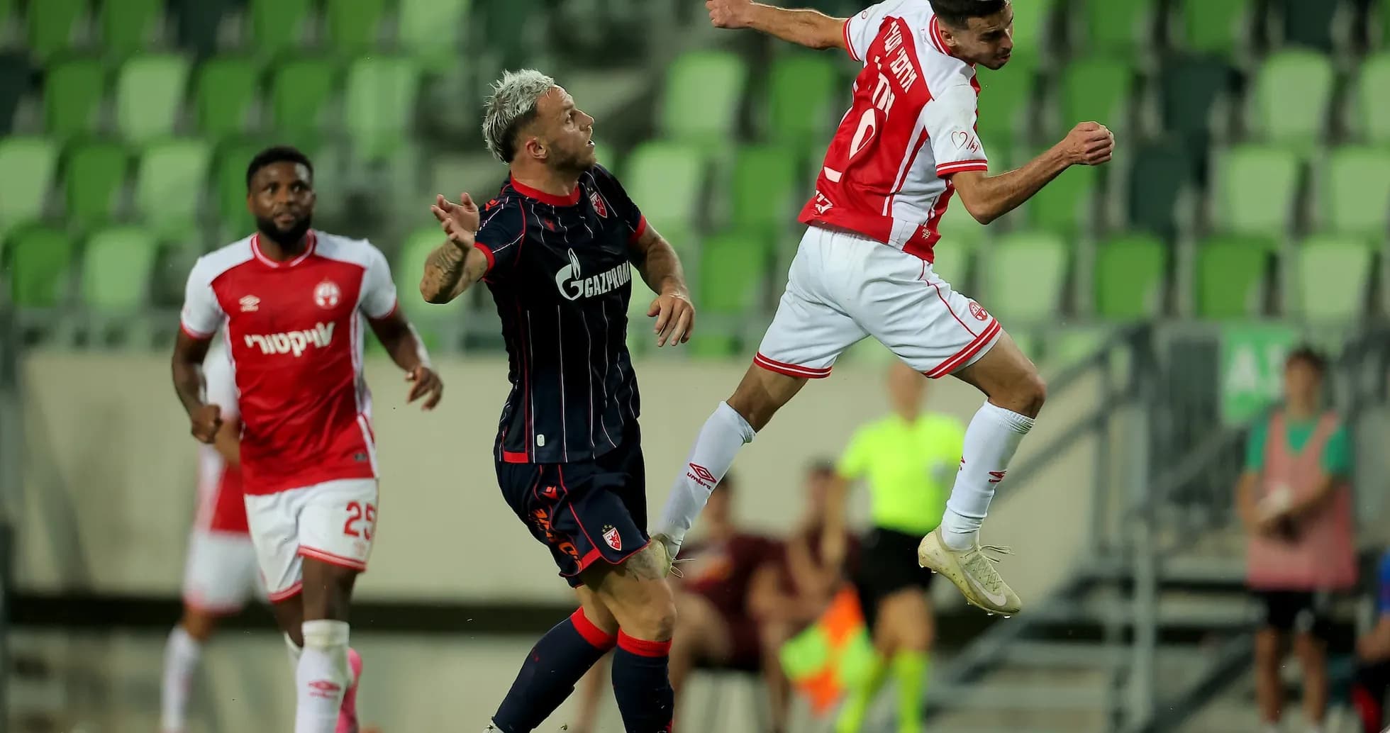 Players competing for the ball during match