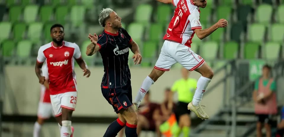 Players competing for the ball during match