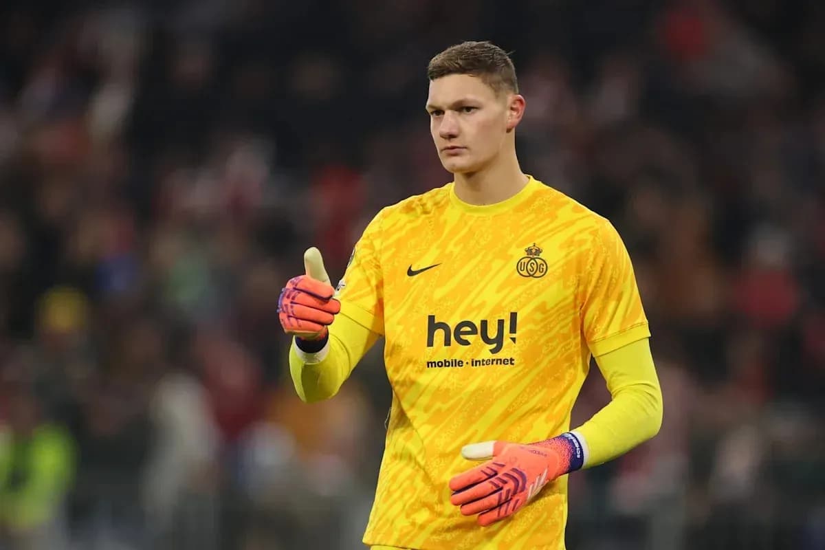 Goalkeeper in yellow jersey giving thumbs up