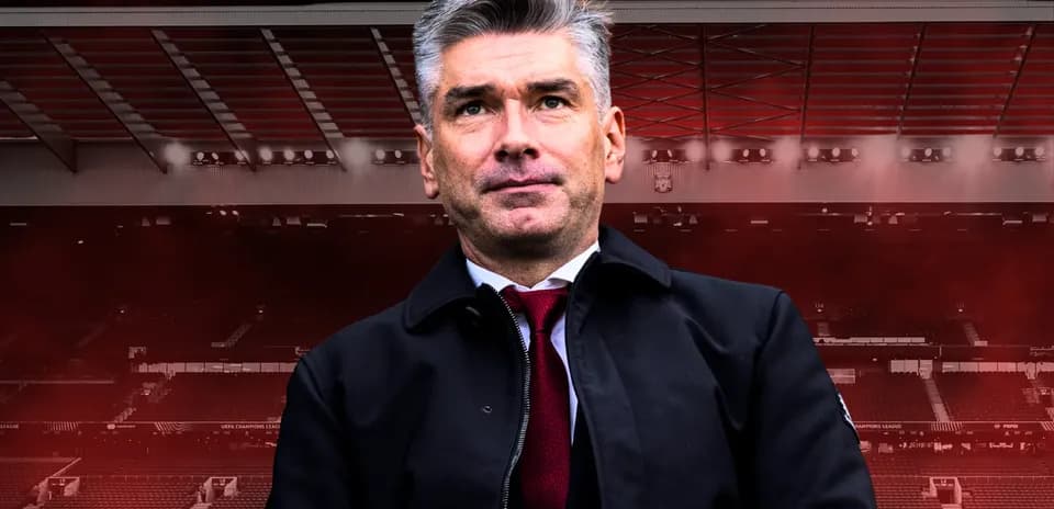 Manager standing in front of stadium background