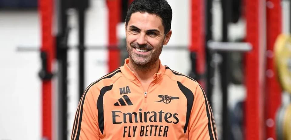 Arsenal manager in training facility wearing team gear