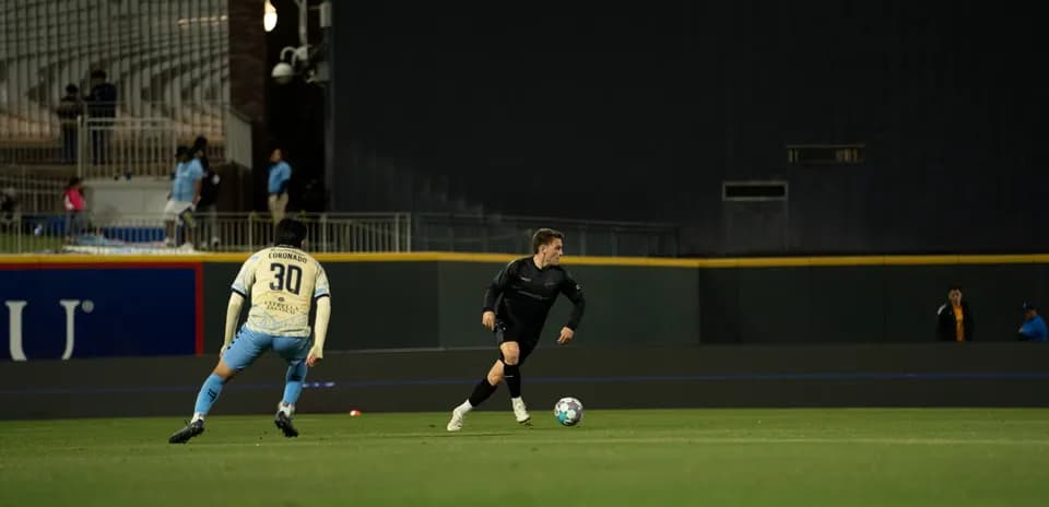 Players competing for the ball during match