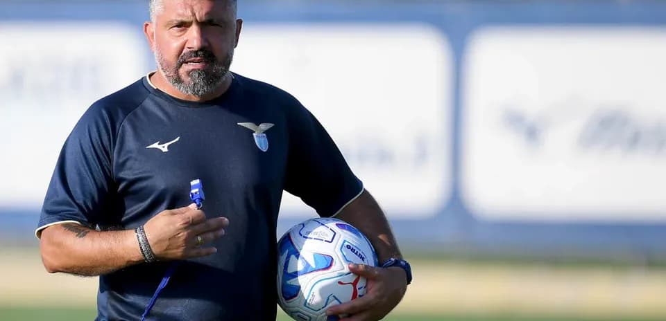 Coach holding a ball during training session