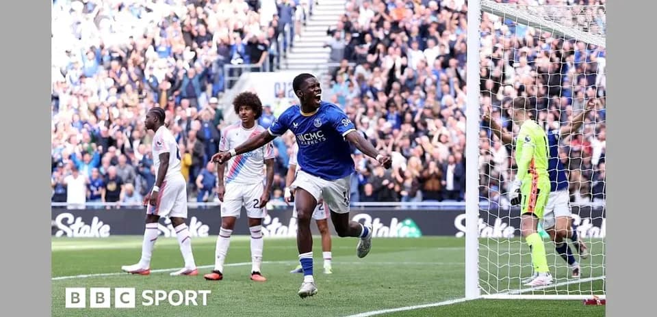 Player celebrating a goal in front of crowd