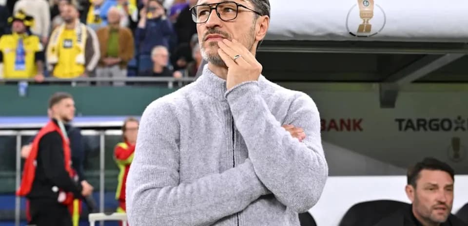 Coach observing the match from the sidelines