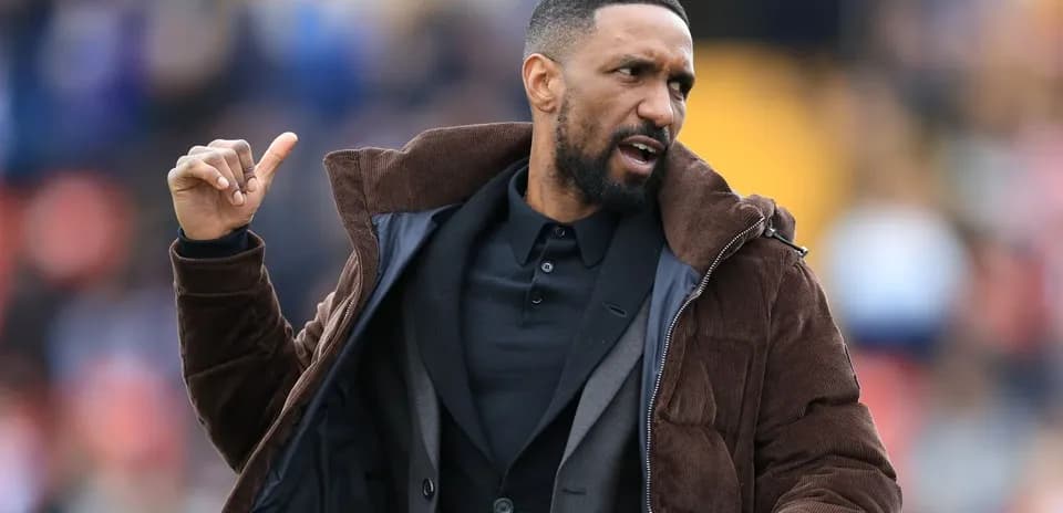 Coach gesturing during a football match