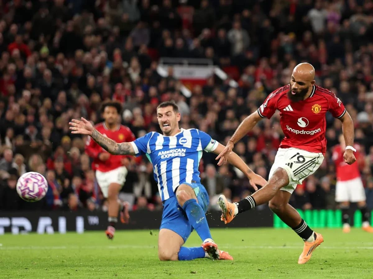 Brighton player tackling Manchester United player