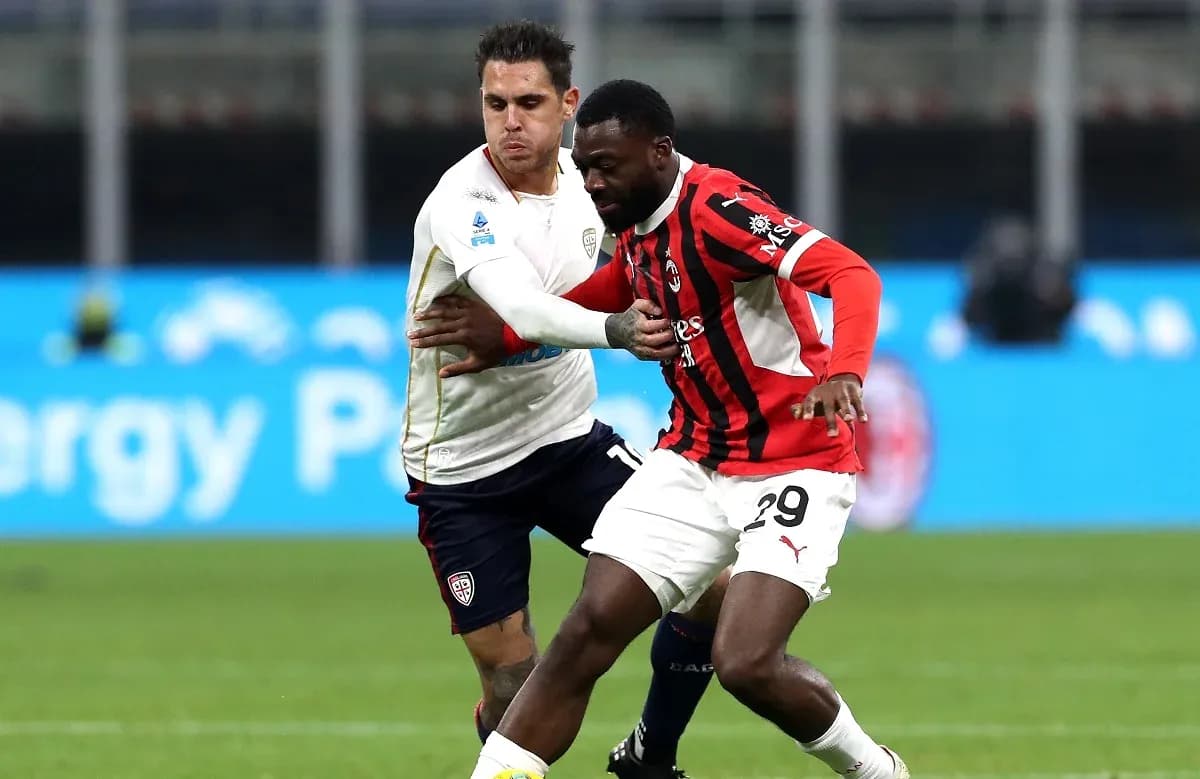 AC Milan player challenges Cagliari opponent for ball