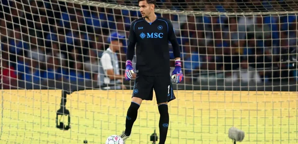 Goalkeeper in black kit preparing for play