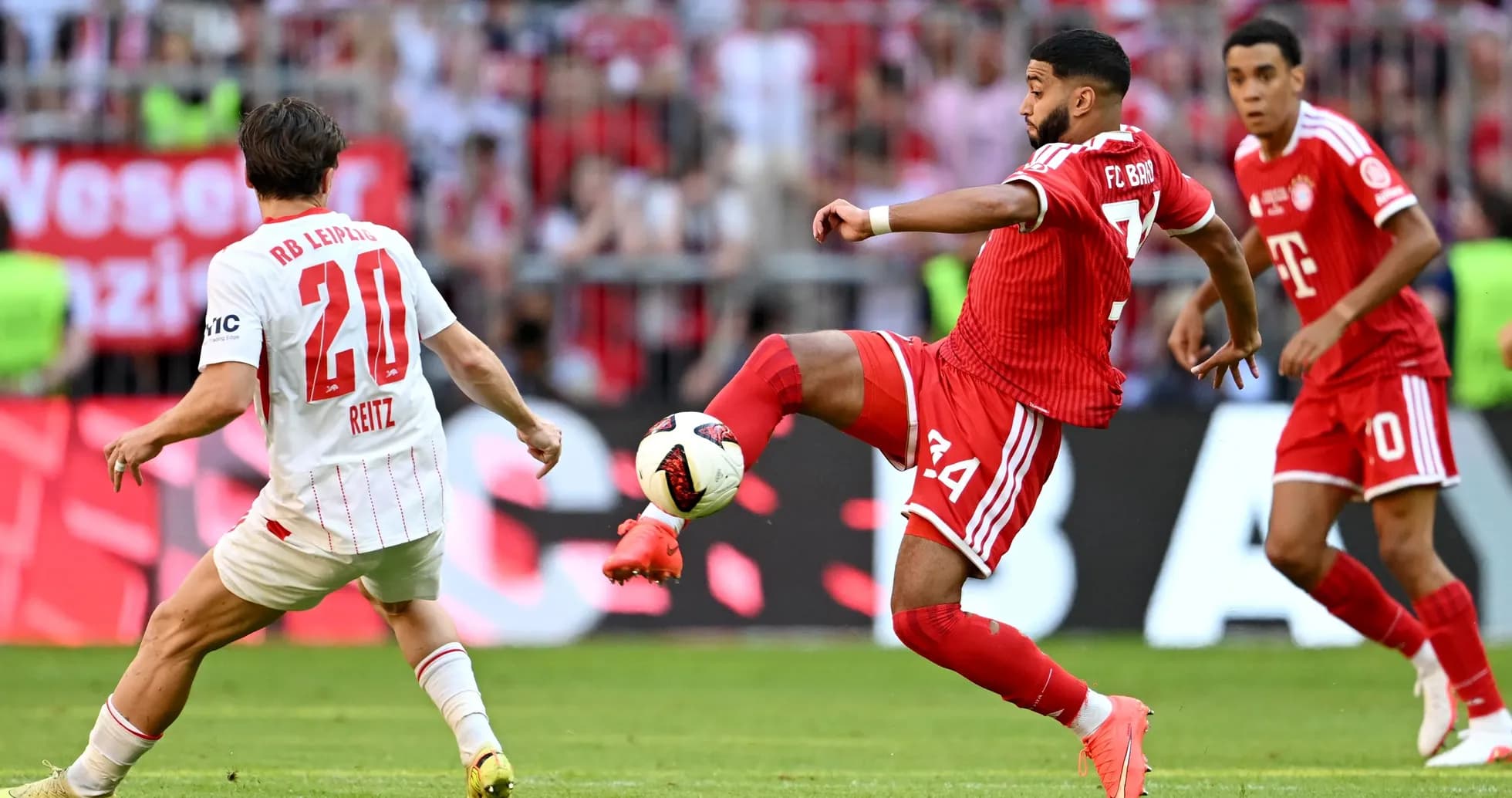 Player from FC Bayern kicking the ball against RB Leipzig