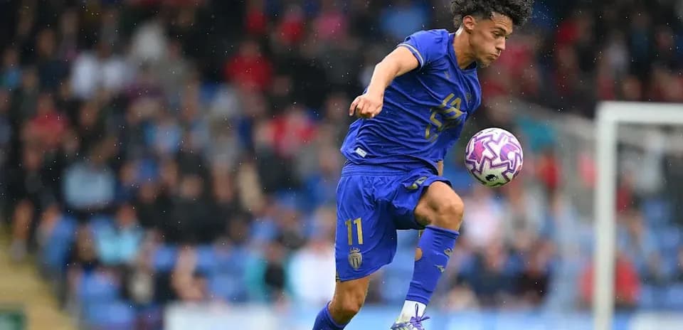 Player in blue jersey controlling the ball during match