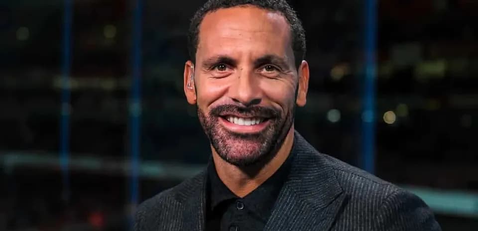 Sportscaster smiling during television broadcast