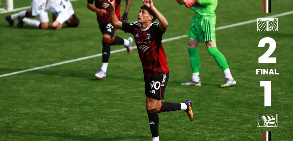 Player celebrating after scoring for Portland Timbers II