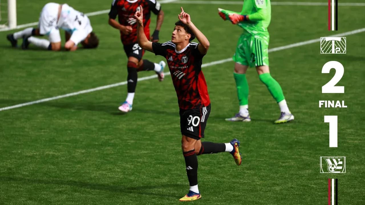 Player celebrating after scoring for Portland Timbers II