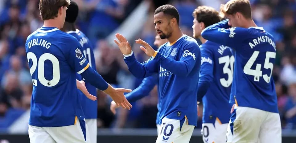 Everton players celebrating a goal during match