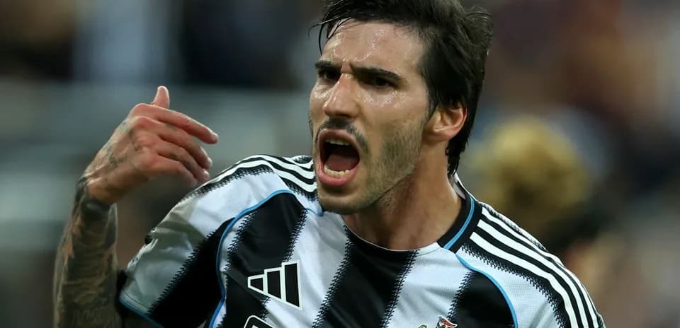 Player celebrating passionately in Newcastle jersey