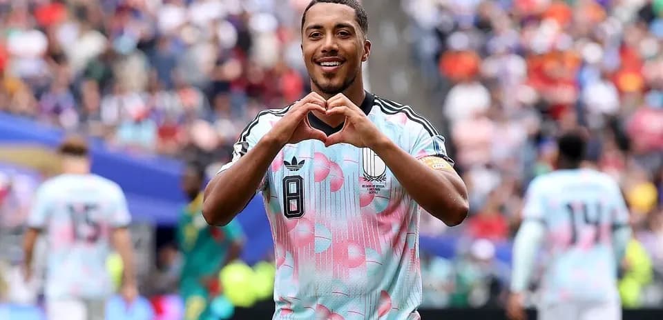 Player celebrating with heart gesture during match