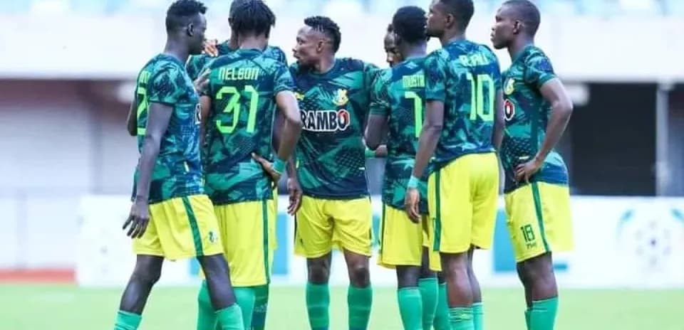 Niger Tornadoes players discussing strategy on field