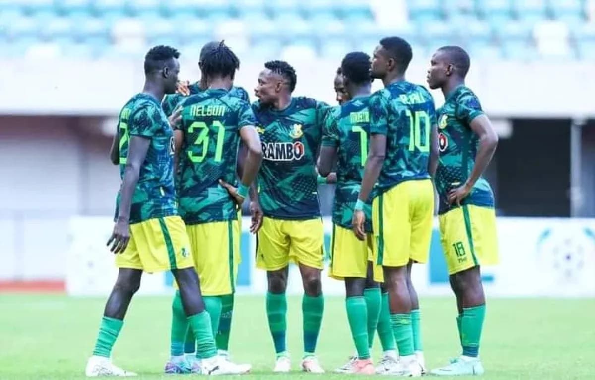 Niger Tornadoes players discussing strategy on field