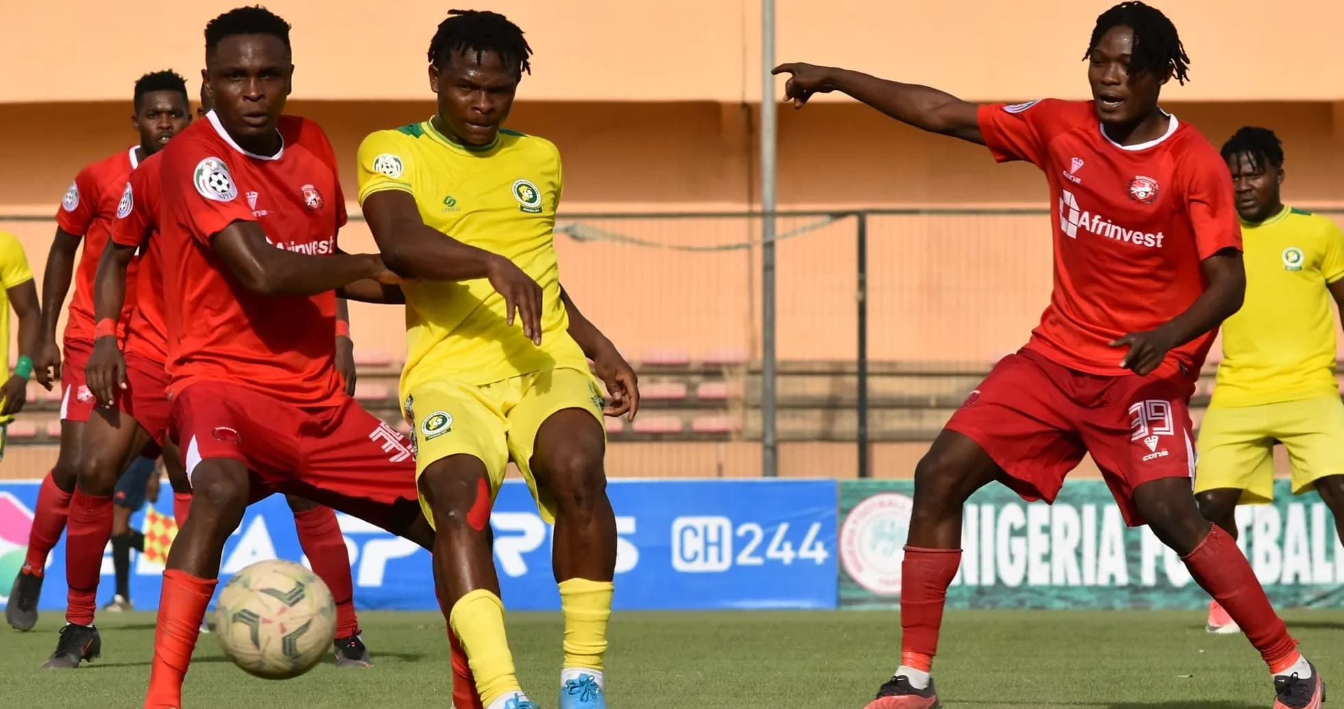 Players contesting for the ball in NPFL match
