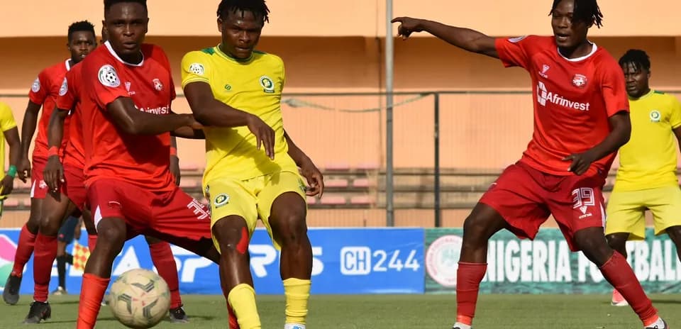 Players contesting for the ball in NPFL match