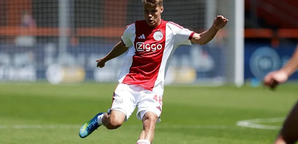 Ajax player kicking the ball during training session