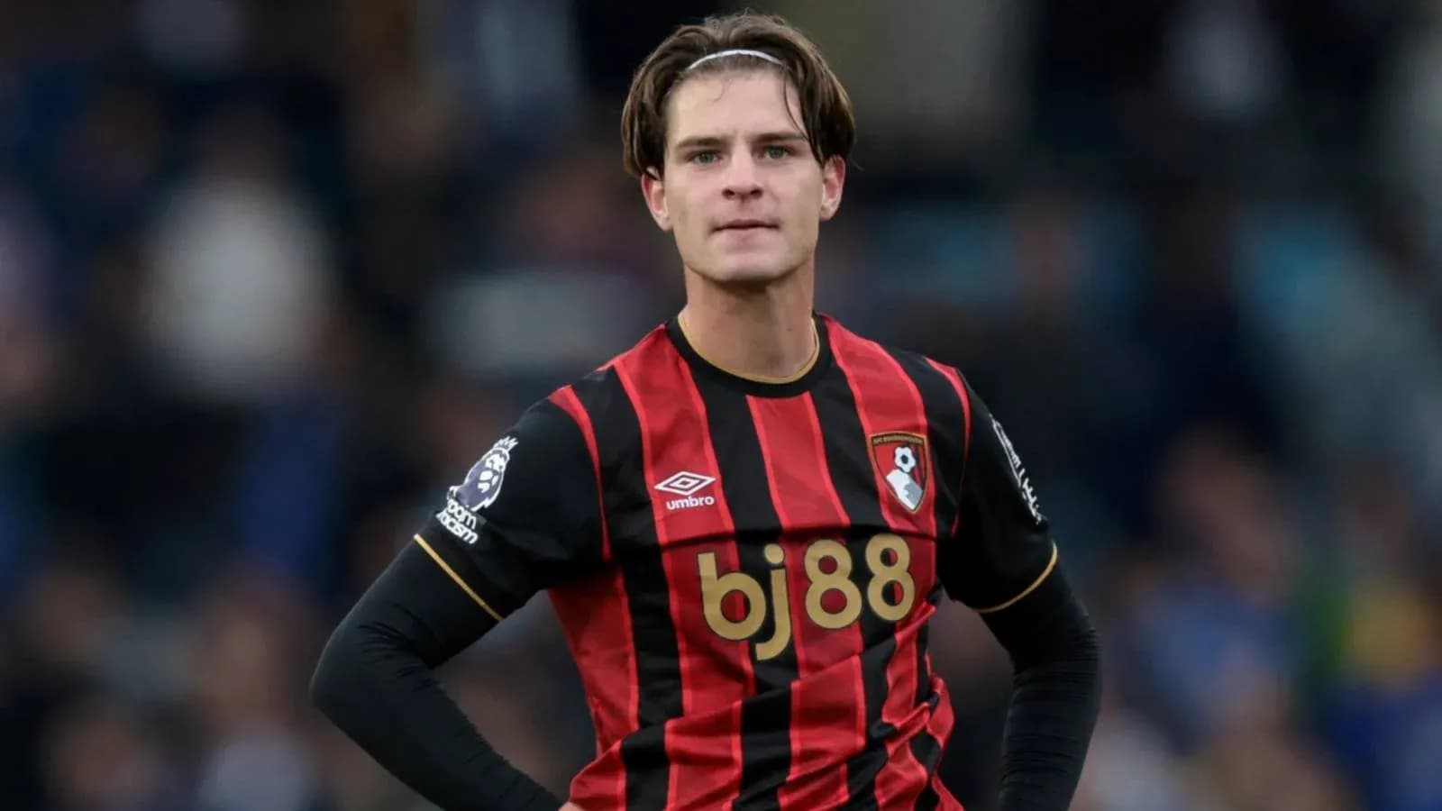 Bournemouth player in black and red kit on field