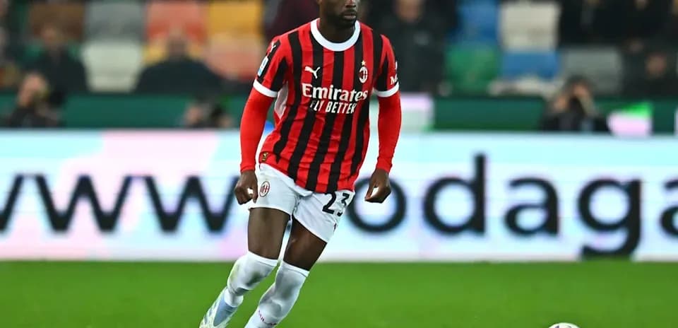 AC Milan player dribbling ball during match