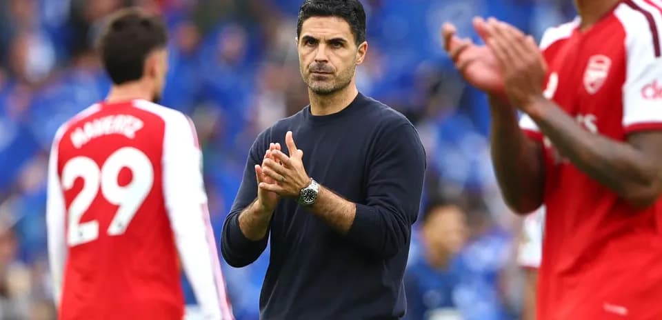 Manager clapping on the sideline during match